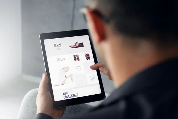 man shopping online using tablet